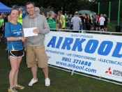 emma-brown-1st-lady-receives-her-prize-from-richard-dawson-of-airkool